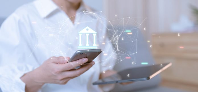 Woman using smartphone conducting online financial transactions through the internet. The concept of Mobile Banking or Virtual Banking technology that is convenient, emphasizing safety. White Label Fintech