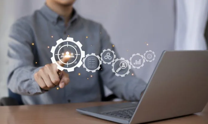 Business marketing position concept, businessman holds dart board icon with arrows for customer target group. Dynamic Content Personalization