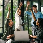 Diverse team celebrating their success and the great work environment