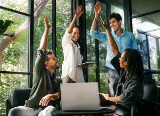 How to Set Teams Up for Success Diverse team celebrating their success and the great work environment