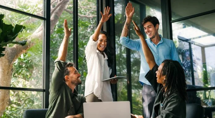 How to Set Teams Up for Success Diverse team celebrating their success and the great work environment