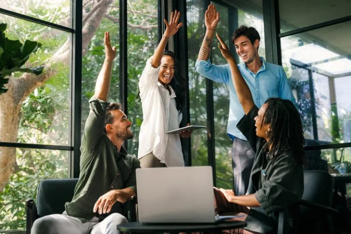 iStock-2214852508 (1) Diverse team celebrating their success and the great work environment