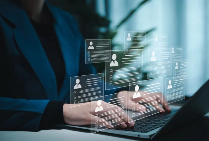 Digital Resume Screening by HR Professional. Human resource manager evaluate multiple resumes or CV online, modern recruitment and candidate selection processes. best employees for corporate business. Composable CDP: The Next Evolution in Customer Data Strategy