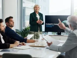 Can European Business Leaders Afford to Deprioritize Climate Risk? European business leaders having a meeting about climate risks