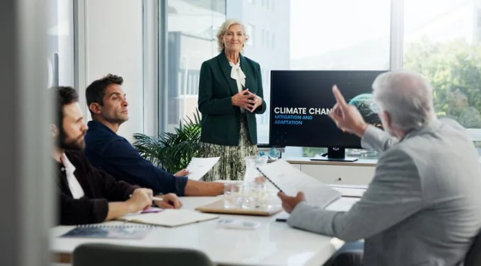 Can European Business Leaders Afford to Deprioritize Climate Risk? European business leaders having a meeting about climate risks