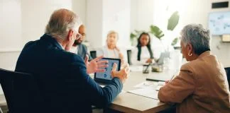Superstar firms having a meeting in office for finance