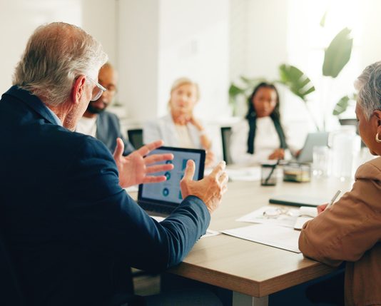 Superstar firms having a meeting in office for finance