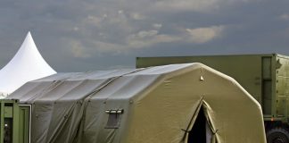 Tent for placement of personnel on military range. Environmental control unit