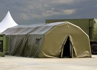 Tent for placement of personnel on military range. Environmental control unit
