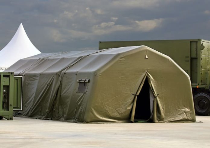 Tent for placement of personnel on military range. Environmental control unit