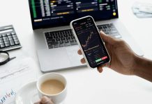 Top 10 MT5 Tips and Tricks Every Trader Should Know (2025 Edition) Person holding a Smartphone for MT5 trading