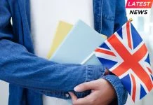 UK Rejoins - student holding book with flag