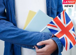UK Rejoins - student holding book with flag
