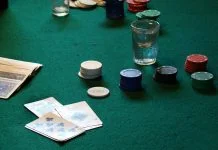 From Stream to Studio: Why Live Dealer Tables are Still Winning in the Age of AI and Automation table with poker chips and cards for live dealer casino