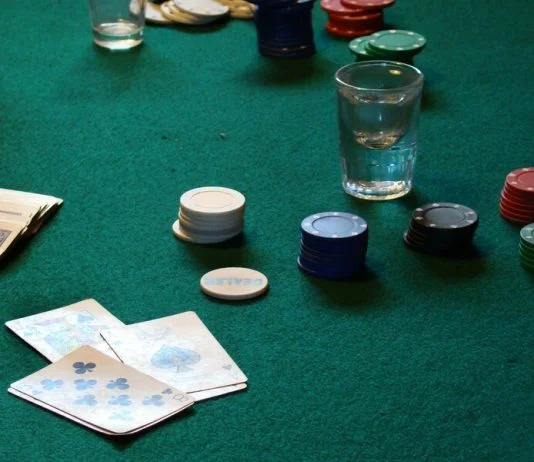 From Stream to Studio: Why Live Dealer Tables are Still Winning in the Age of AI and Automation table with poker chips and cards for live dealer casino