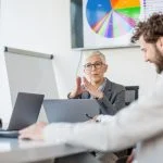 CEO using technology for presenting data