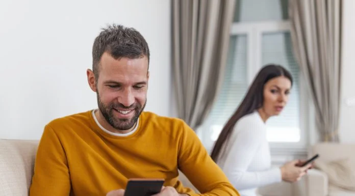 How to Catch a Cheating Partner Using Tech Experts – Smart Tool For Infidelity husband holding phone texting cheating on cellphone