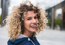 Portrait of a young woman with curly hair