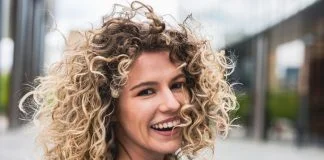 Portrait of a young woman with curly hair