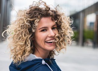 Portrait of a young woman with curly hair