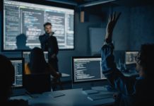 Teacher Giving Computer Science Lecture to Diverse Multiethnic Group in Business Schools