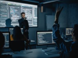 Teacher Giving Computer Science Lecture to Diverse Multiethnic Group in Business Schools