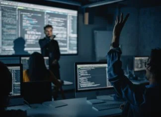 The Creativity Quotient: Can Business Schools Really Teach What AI Will Never Learn? Teacher Giving Computer Science Lecture to Diverse Multiethnic Group in Business Schools