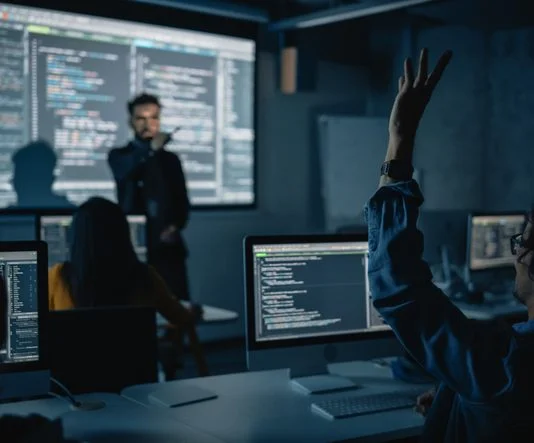 Teacher Giving Computer Science Lecture to Diverse Multiethnic Group in Business Schools