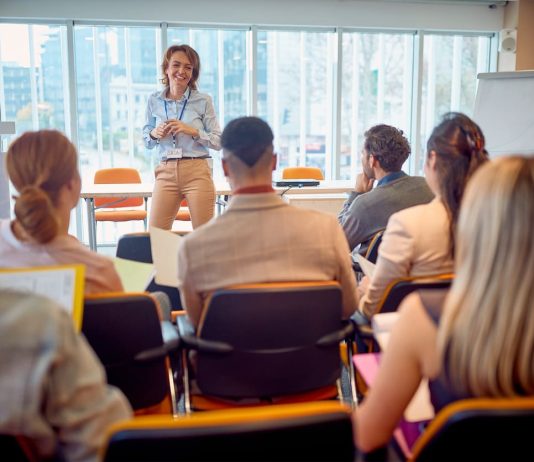 Corporate - business woman holding presentation