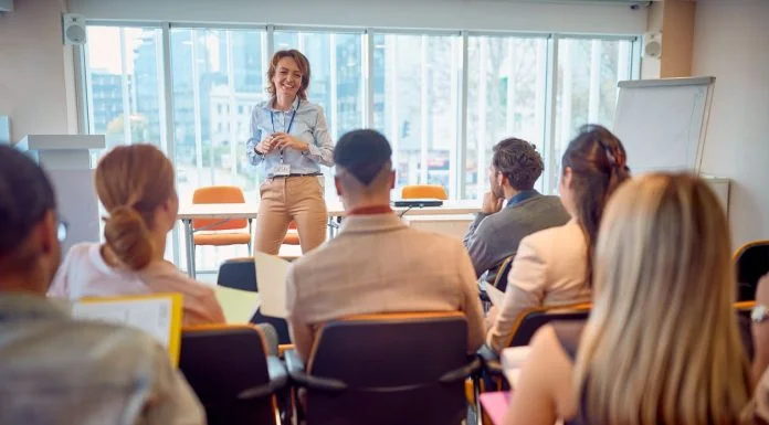 Why Corporate Training is Not Just For New Employees Corporate - business woman holding presentation
