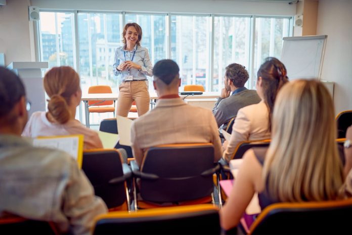 Corporate - business woman holding presentation