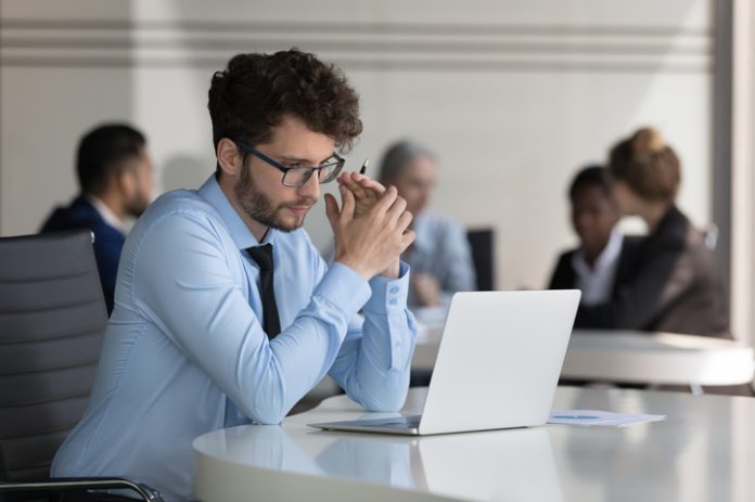 Businessman working on market research sit at desk with laptop leadership gap