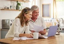 An older couple considers estate planning decisions that they intend to make in their wills.