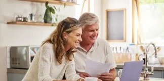 An older couple considers estate planning decisions that they intend to make in their wills.