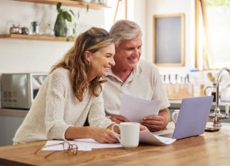 An older couple considers estate planning decisions that they intend to make in their wills.
