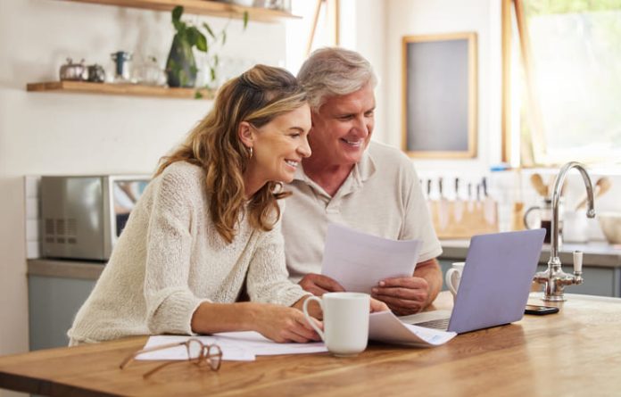 An older couple considers estate planning decisions that they intend to make in their wills.
