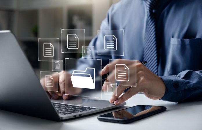 Businessman pointing folder and document File Sync and File Shredder Tools