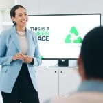 Business people, hospitality, sustainability and woman with presentation, conference or ecology with partnership, corporate training or carbon footprint.