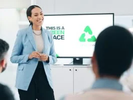 Business people, hospitality, sustainability and woman with presentation, conference or ecology with partnership, corporate training or carbon footprint.