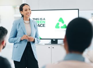 Business people, hospitality, sustainability and woman with presentation, conference or ecology with partnership, corporate training or carbon footprint.