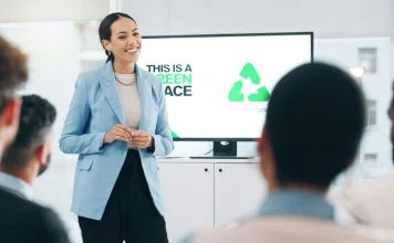 Business people, hospitality, sustainability and woman with presentation, conference or ecology with partnership, corporate training or carbon footprint.