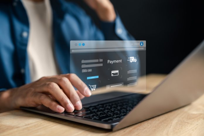 Online shopping and secure digital payment. Man making a transaction on an ecommerce platform via laptop, with virtual checkout interface, credit card input, and shipping details. Bank Website Design