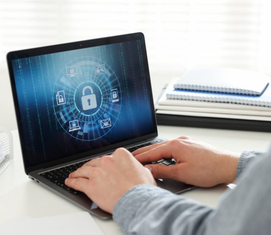 man using computer with antivirus