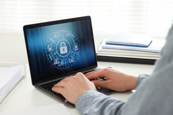 man using computer with antivirus