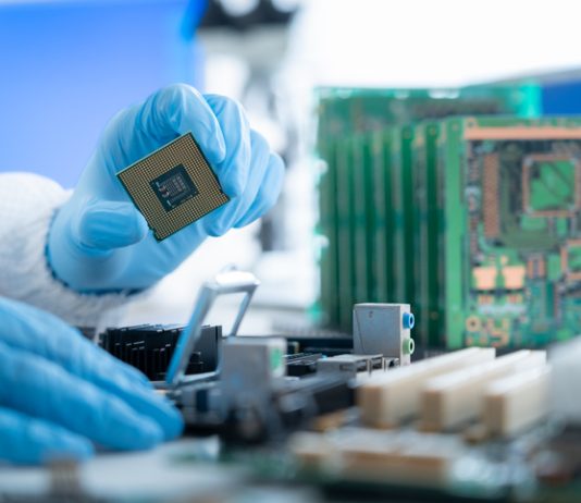 Semiconductor Industry Enters New Growth Cycle Person working in semiconductors industry