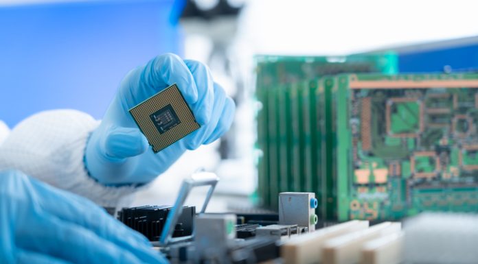 Semiconductor Industry Enters New Growth Cycle Person working in semiconductors industry