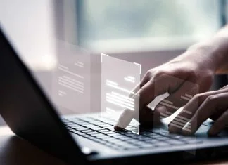 How to Prevent Data Loss When Converting PDFs Into Forms Prevent data loss - Hand using laptop