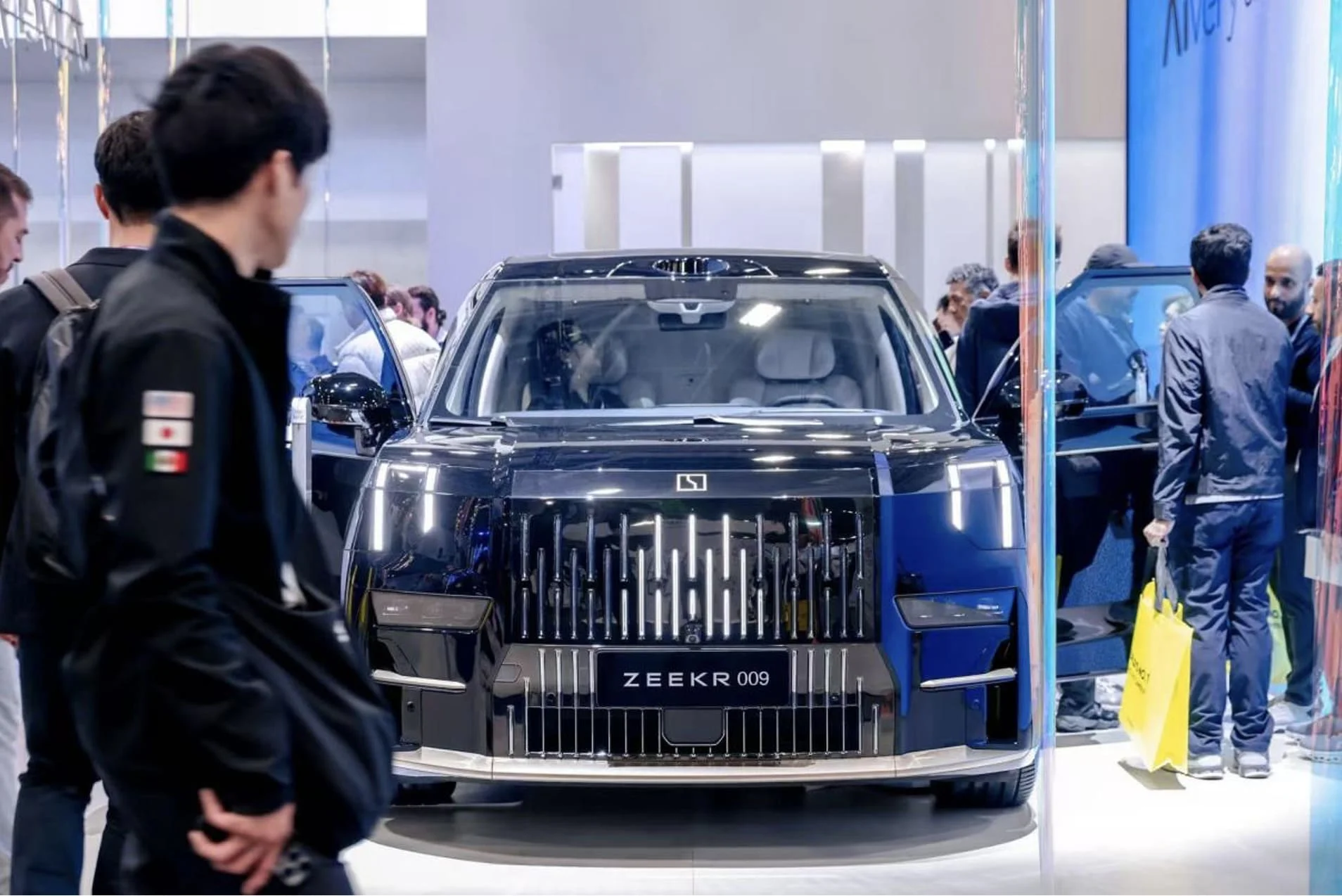 A close-up of the ZEEKR 009 luxury electric MPV on display.