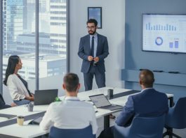 Office Conference Room Meeting: Digital Enterpreneur Presents e-Commerce Investment Strategy for Group of Investors. Boardroom Strategies for Dominating AI Investments, Risks, and Value