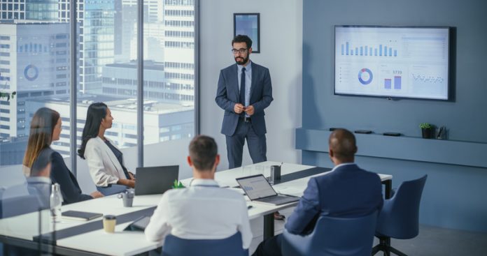 Office Conference Room Meeting: Digital Enterpreneur Presents e-Commerce Investment Strategy for Group of Investors. Boardroom Strategies for Dominating AI Investments, Risks, and Value